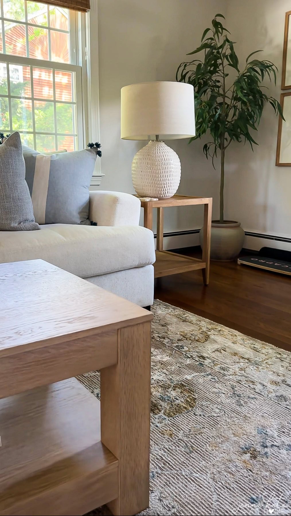 The existing side table was too dark and clashed with the new, lighter wood coffee table.