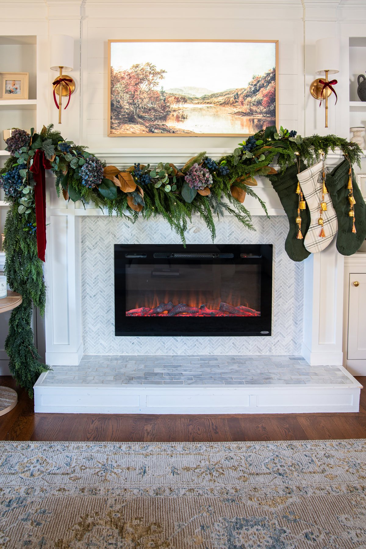 Garland draping across the mantel with magnolia leaves and dried hydrangeas.