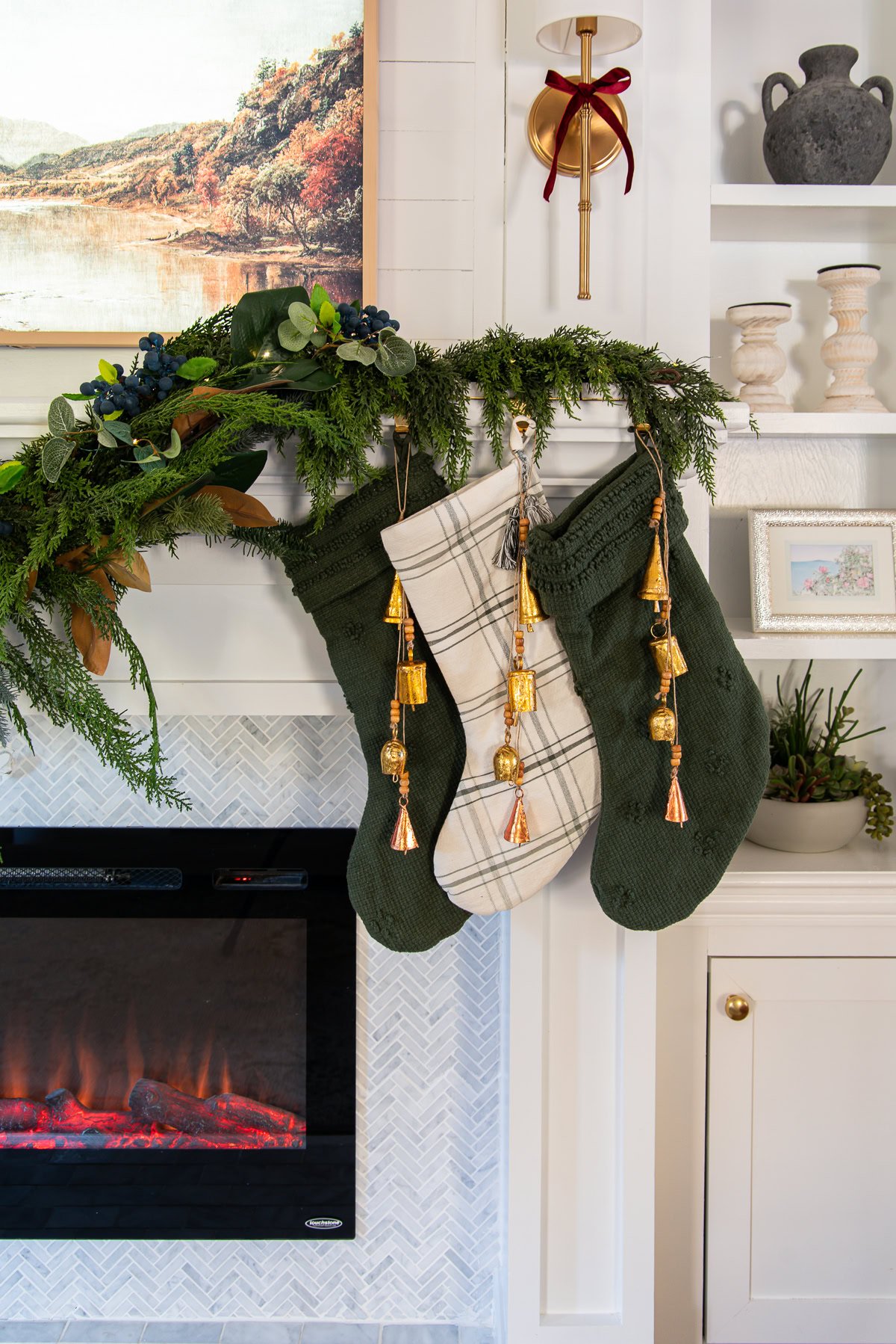 Stockings in the corner with bells hanging from each one.
