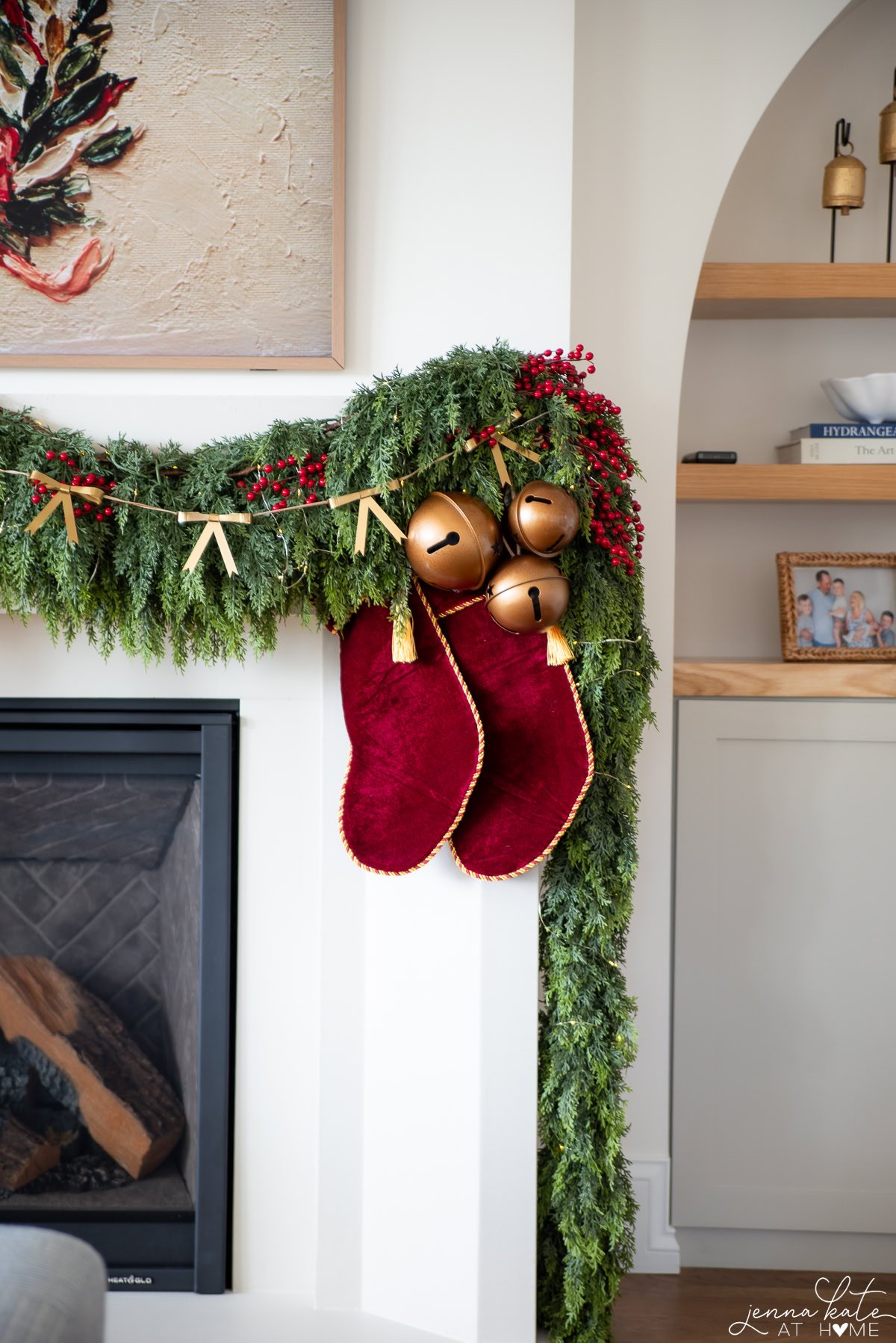 Cluster of jingle bells over two red Christmas stockings.
