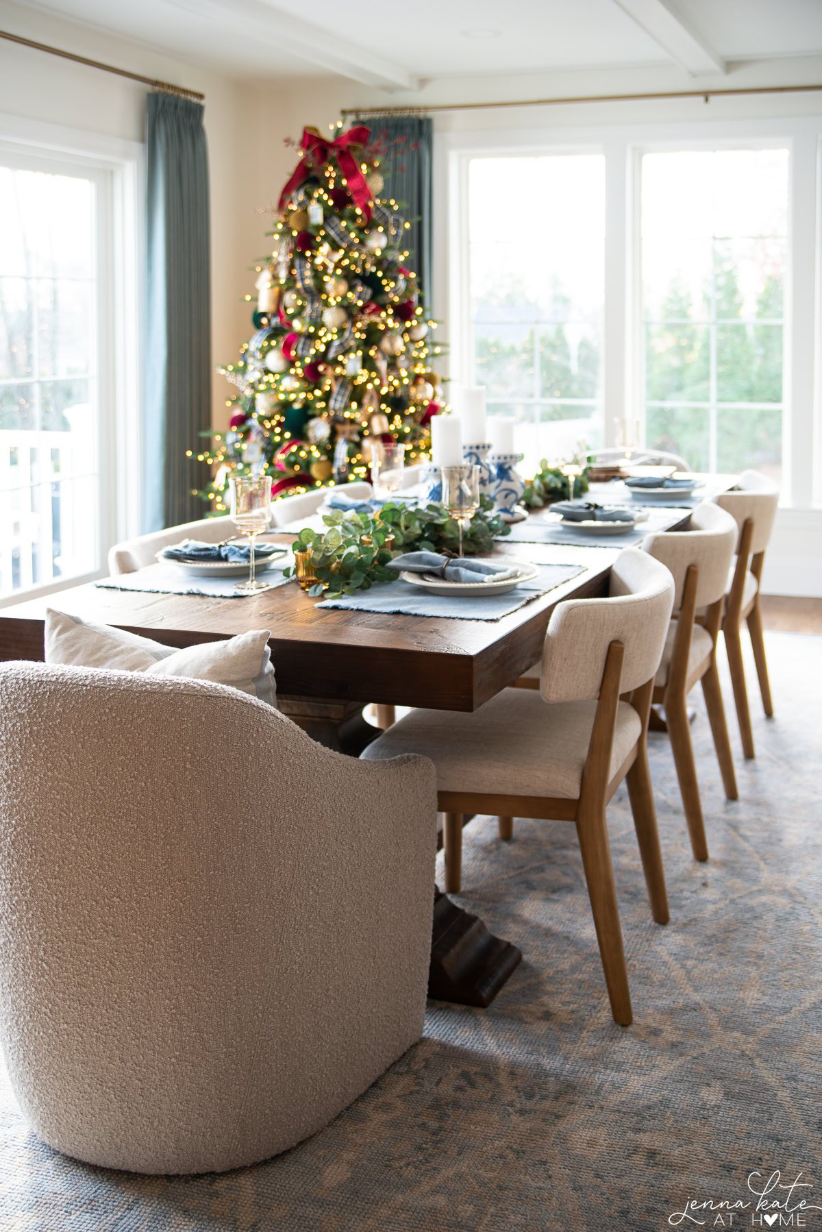 Tablescape with Christmas tree in the background.